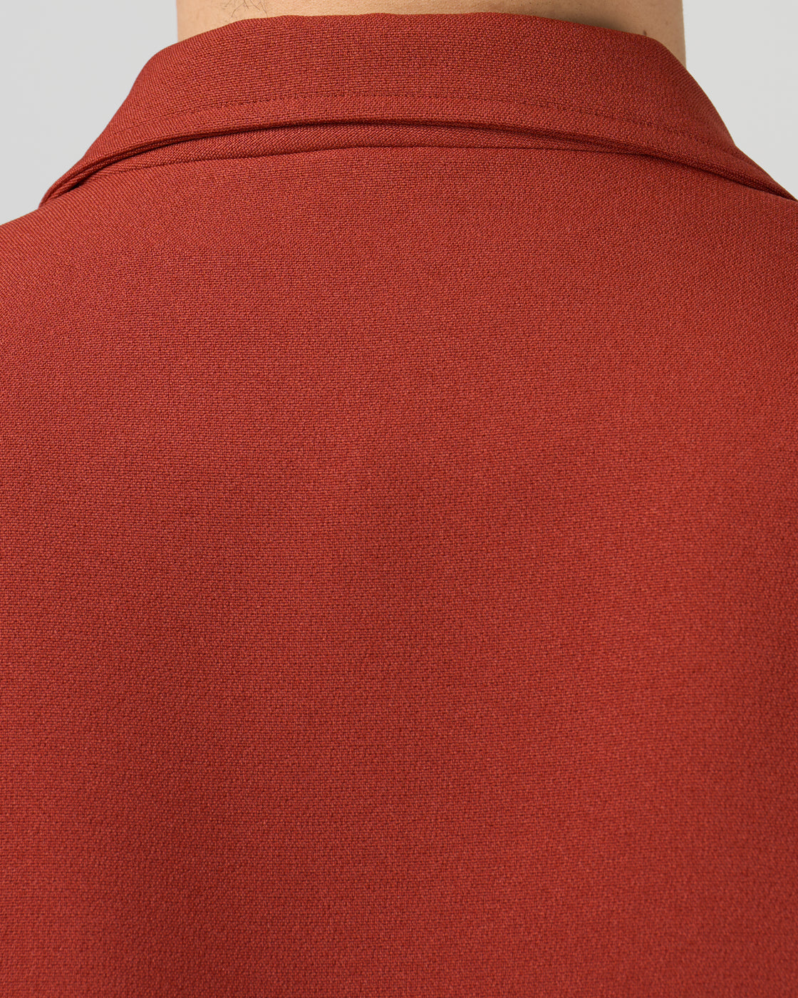 Dhal ダブルフェイスジャージージャケットのポケット詳細、フラップポケットのデザインと配置、ジャージー素材の柔らかな質感、レンガ色の絶妙なトーン、クラシックなテーラードディテール、日本製メンズジャケット、keylime Tokyo
