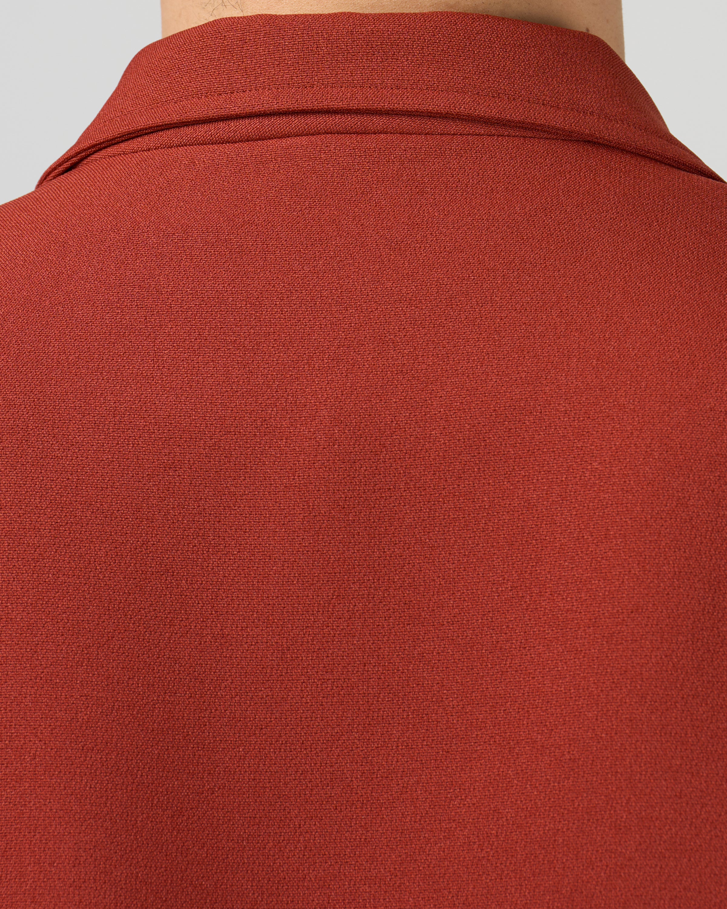 Dhal ダブルフェイスジャージージャケットのポケット詳細、フラップポケットのデザインと配置、ジャージー素材の柔らかな質感、レンガ色の絶妙なトーン、クラシックなテーラードディテール、日本製メンズジャケット、keylime Tokyo
