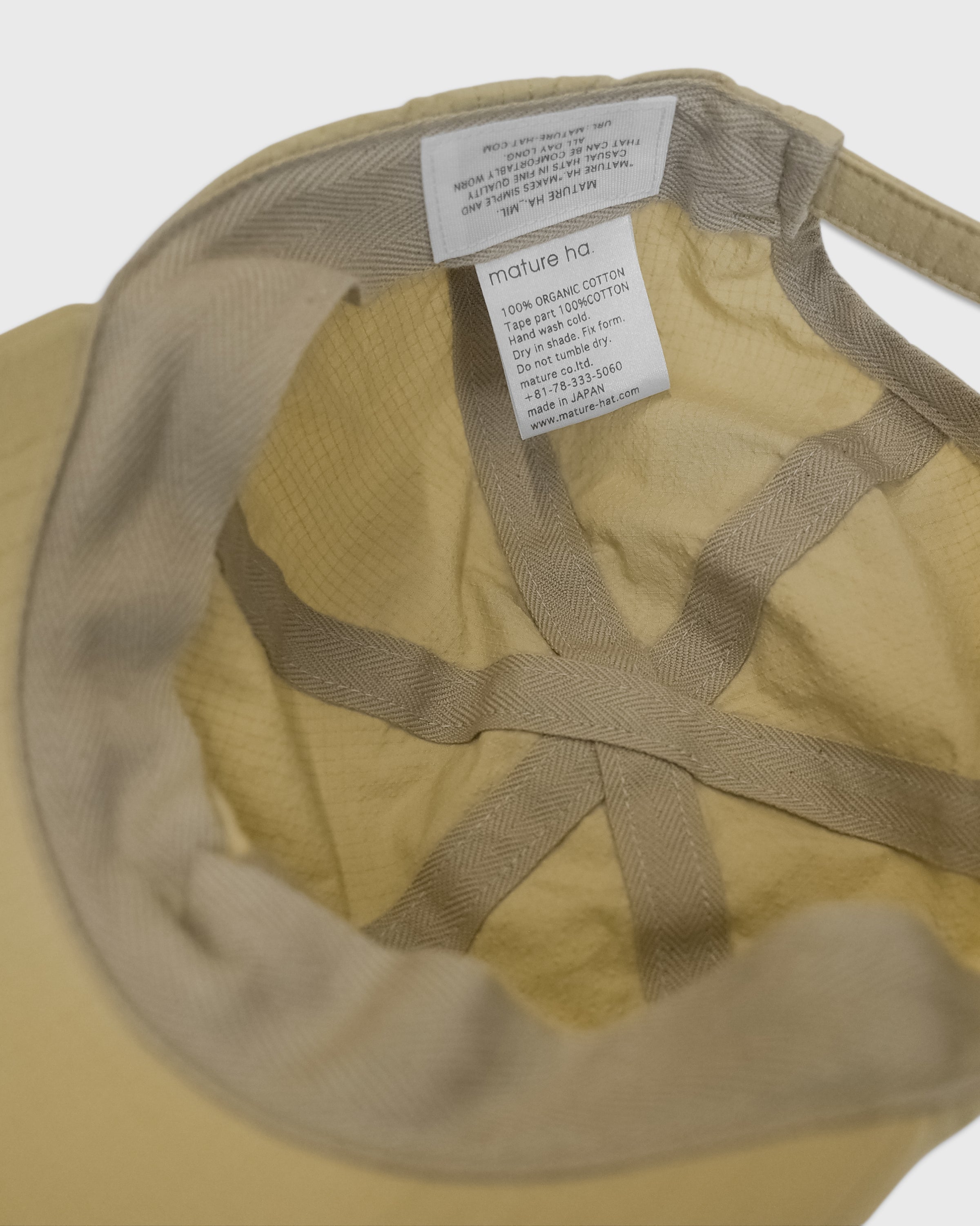 MATURE HA._MIL Trainer Cap Low Lipstop Washed, Muted Yellow
